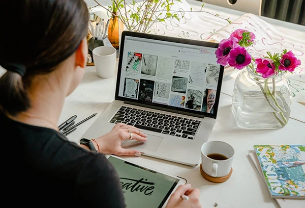 person-using-laptop-for-graphic-designs